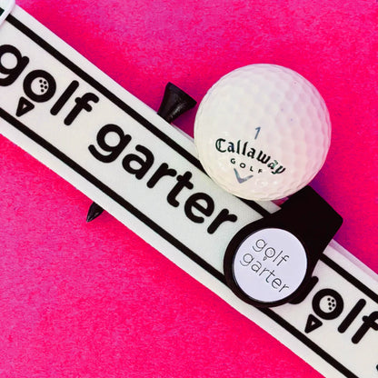 Golf Garter Girl Starter Pack with the Black color variant of the fold-over magnetic golf ball marker.