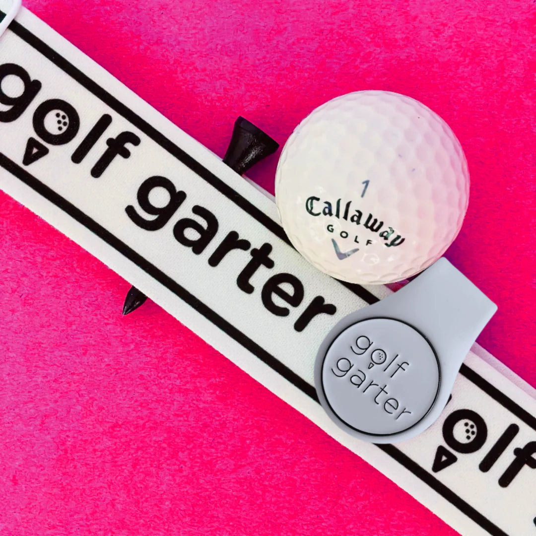 Golf Garter Girl Starter Pack with the White color variant of the fold-over magnetic golf ball marker.